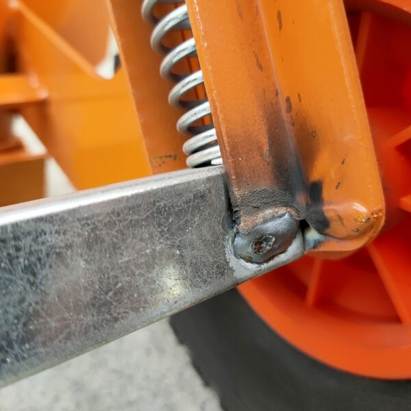 The weld on the back of the orange hand truck