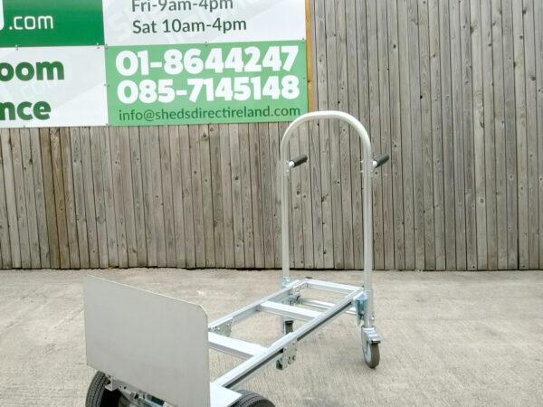a 45 degree angle view of the 2 in 1 sac truck from sheds direct ireland. It's in the flatbed position and stationed against a wooden wall