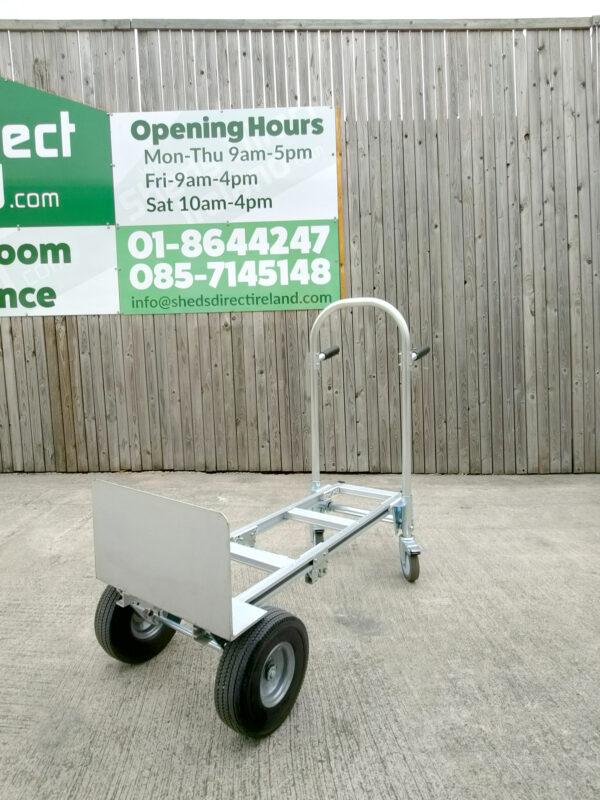 a 45 degree angle view of the 2 in 1 sac truck from sheds direct ireland. It's in the flatbed position and stationed against a wooden wall