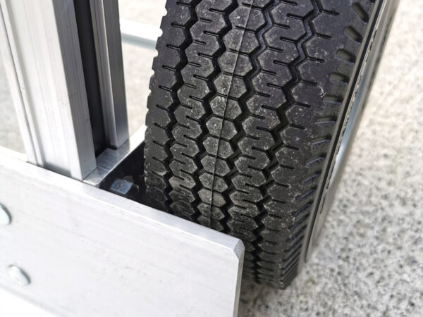 a close up view of the wheel protectors from the 2 in 1 sack truck