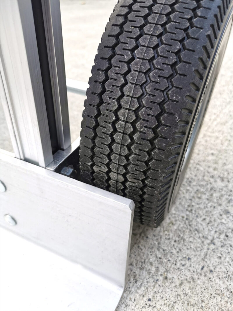 a close up view of the wheel protectors from the 2 in 1 sack truck