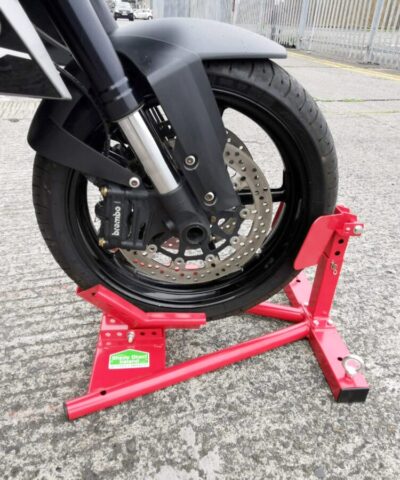 A close up of the motorbike stand in use. A motorbike wheel is raised and locked in place