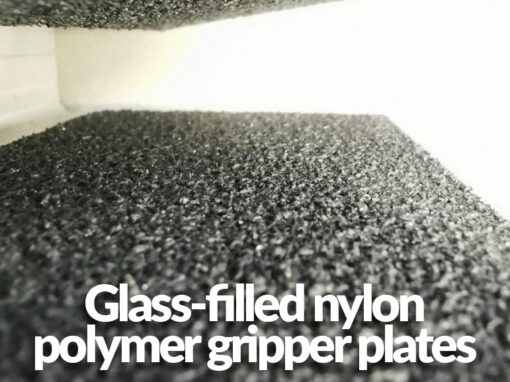 A macro close up of the plates. It reads 'glass-filled nylon polymer gripper plates'