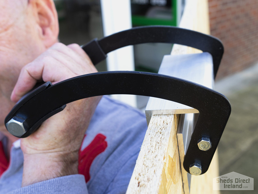 Alan Dawson, founder of Sheds Direct Ireland using the panel carrier with a sheet of plywood