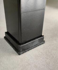 The black rubber base edges of the tool shelf