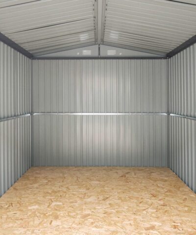 A view of the inside of the premium shed as seen from the doorway. The walls are a pale grey, the floor is a gold-shade of plywood and the brace bars are a dark grey