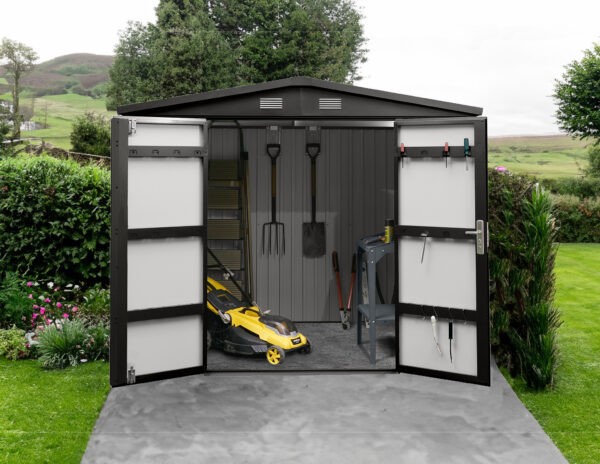 The premium apex shed with both doors opening, showing a lawnmower and many tools inside. The background is an rural Irish scene
