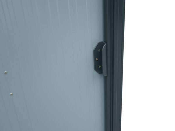 A close up of the door on the tiny shed. It's light grey with a dark grey time and dark grey handle
