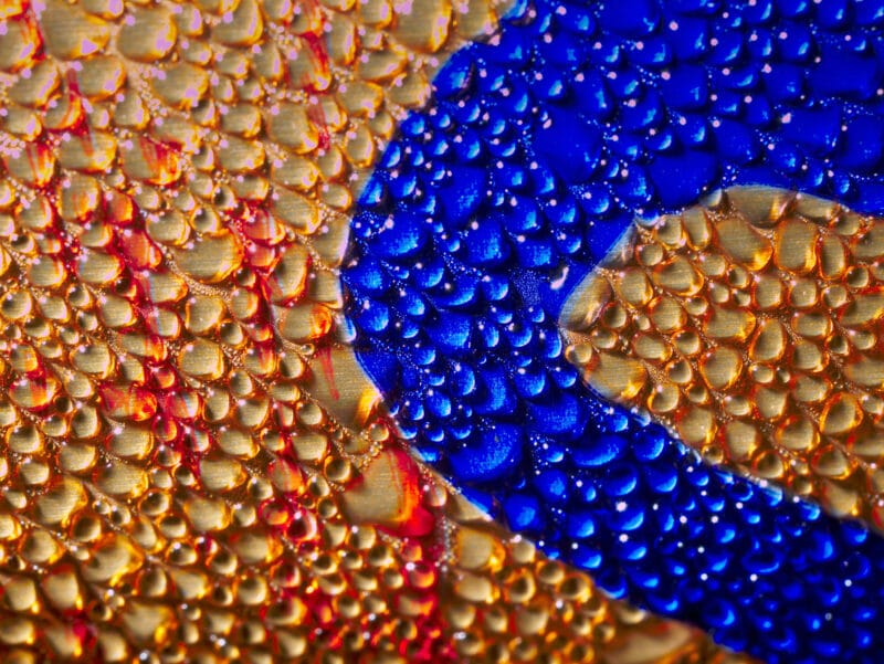 water droplets forming as humidity and condensation on a metal surface