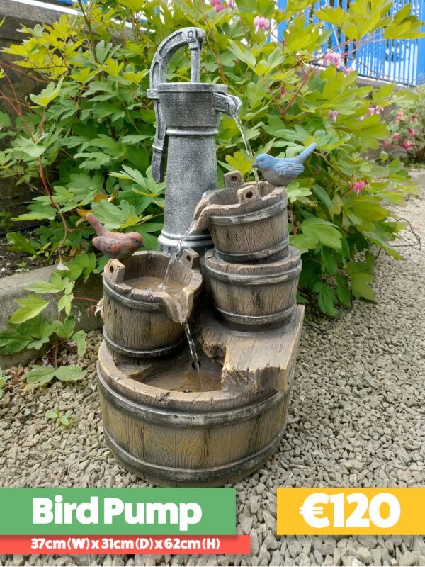 The Bird Pump Water Feature against a wooden shed