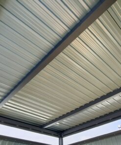 A view of the reinforced roof. It is a pale grey sheet with three thick, dark-grey bars supporting it.