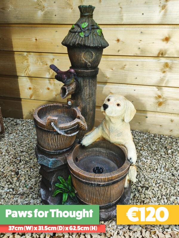 The Paws for Thought Water Feature. There is a dog and a bird on it and the water flows between them.