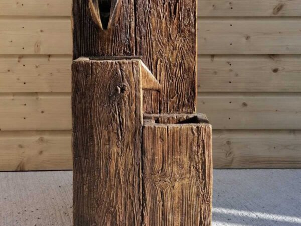 The Timber-Flow Water Feature is three large blocks of wood with the water flowing down them