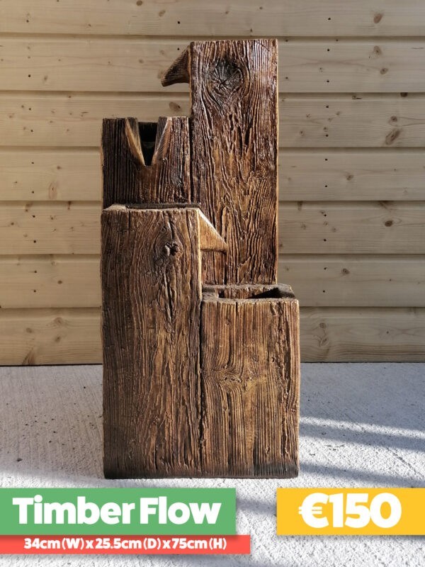 The Timber-Flow Water Feature is three large blocks of wood with the water flowing down them