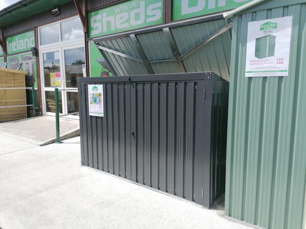 An alternative view of the bin store as seen from the right. The lid is open and the Sheds Direct Ireland showroom is visible behind it.