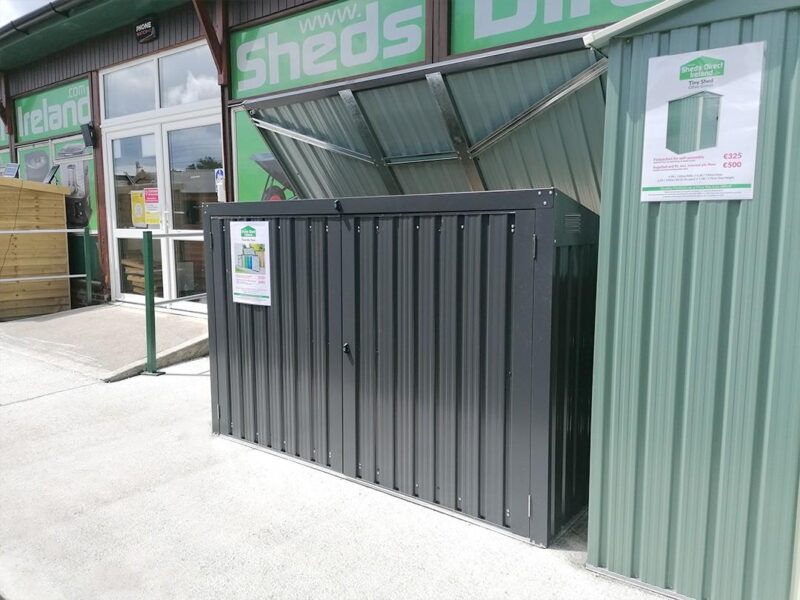 An alternative view of the bin store as seen from the right. The lid is open and the Sheds Direct Ireland showroom is visible behind it.