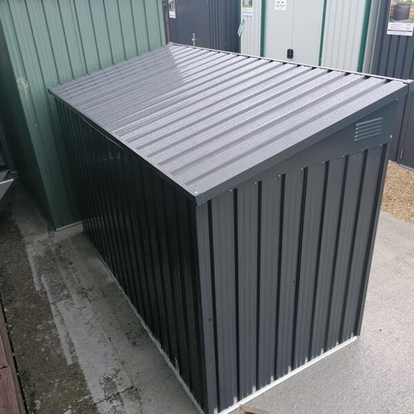 The bin store as seen from behind. The lid is reflecting the sun above so it is brighter in appearance than the rest of the unit