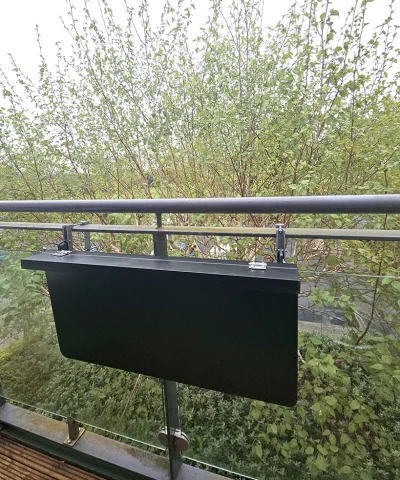 The black balcony shelf on a glass balcony