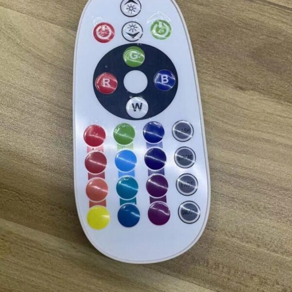 The remote control for the led swing chair. It is a flat unit with a shiny white casing. There are 4 buttons at the top which dictate the speed. Below these are 4 more buttons which control the colour and brightness manually and below these are 16 pre-set colours like red, cyan, lime, pink and purple.