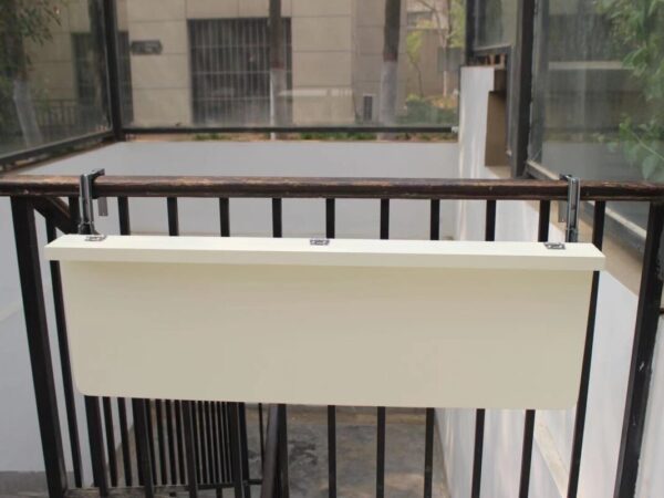 The White balcony railing table in the down position
