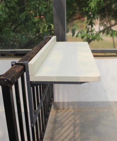 A 90 degree view of the large white railing table