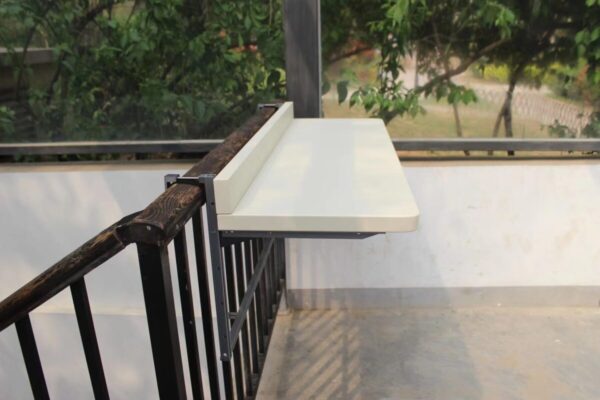 A 90 degree view of the large white railing table
