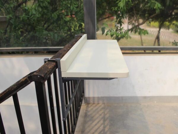 A 90 degree view of the large white railing table