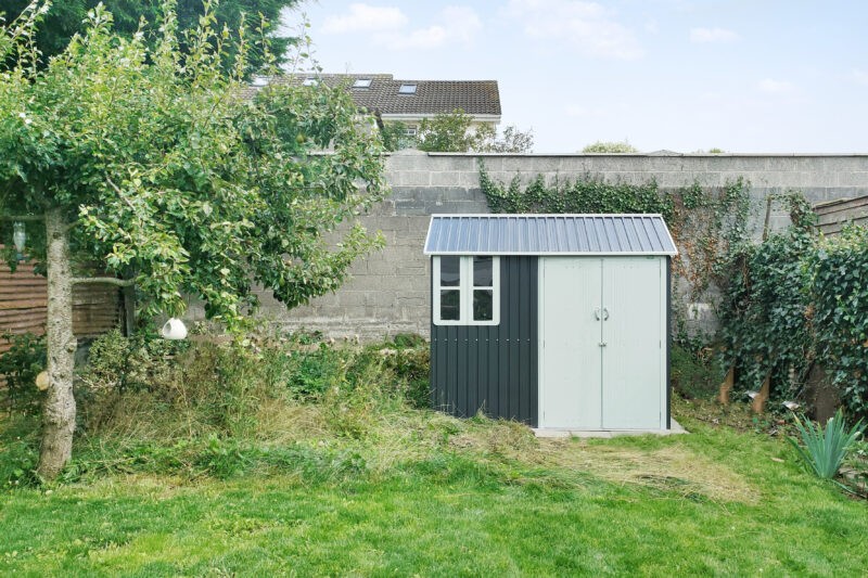 The cottage shed finally in place at the back of the garden. 