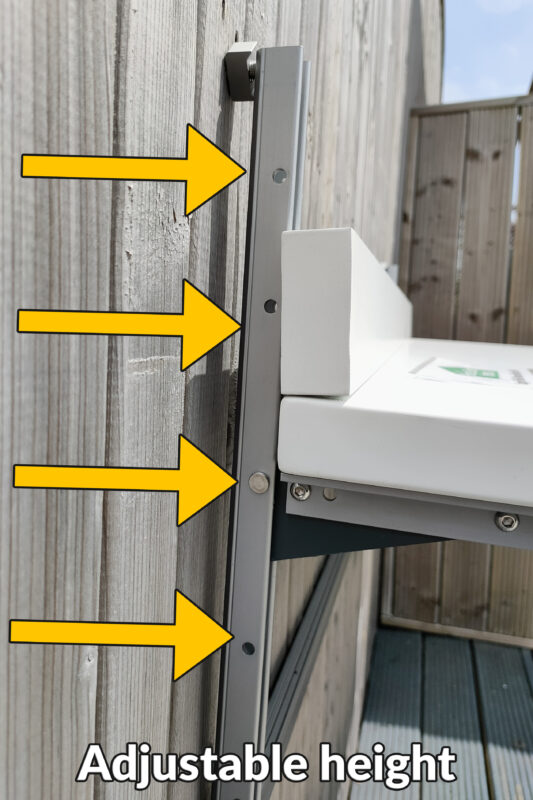 A side view of the balcony table showing the 4 ports that can be used to adjust the height of the unit 