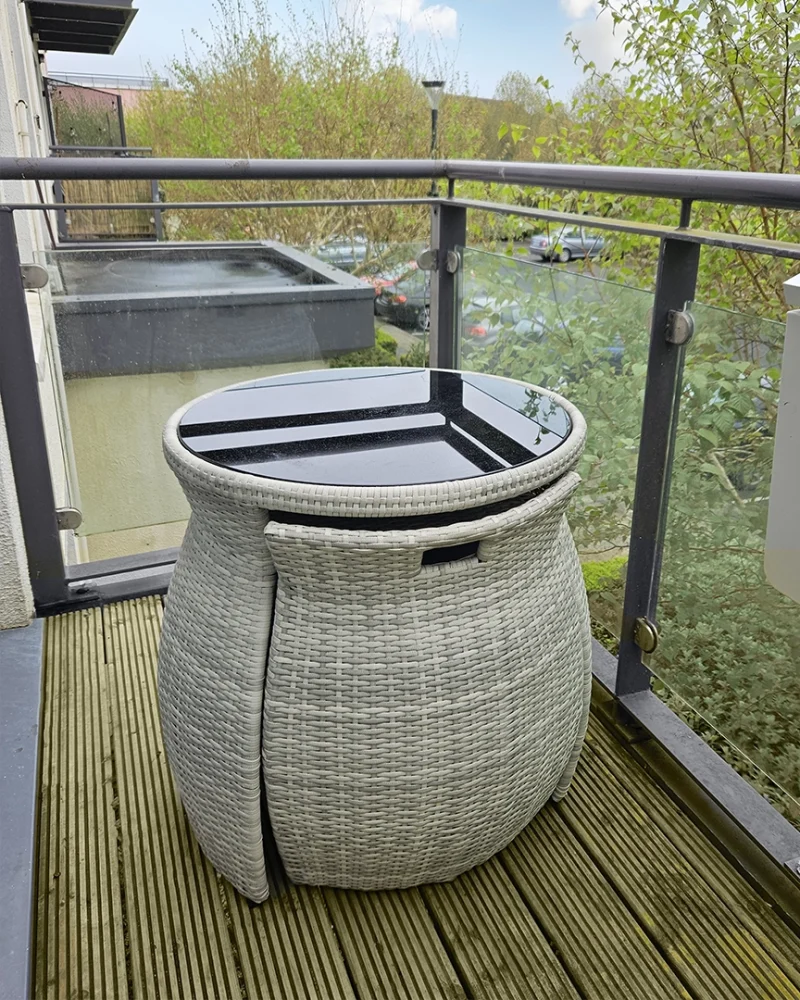 The bistro set compacted on a balcony