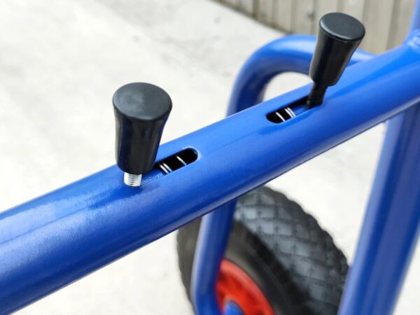 The compressible controls of the blue hand trolley which allow the movement of the back plate