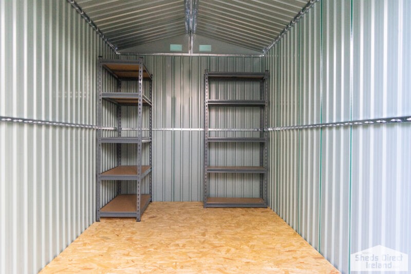 Shelves inside a steel shed. There are 5 tiers and the tiers have wooden bases.