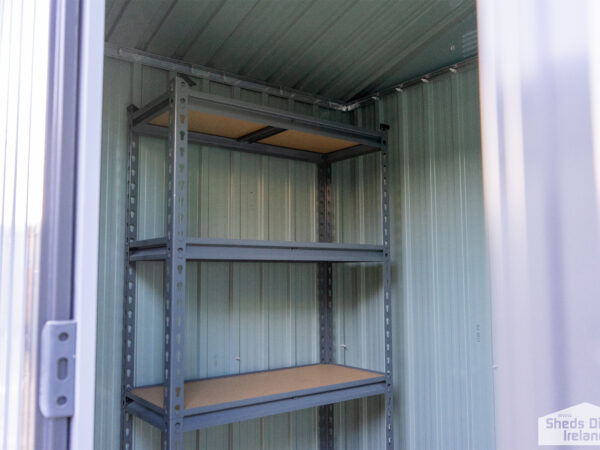 Shelves inside a steel shed. There are 5 tiers and the tiers have wooden bases.