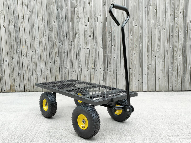 The mesh cart without any panels, presenting as a flatbed. The handle is still in the upright position and the yellow from the rims of the tyres are visible