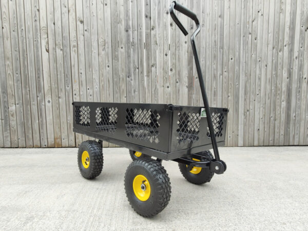 The black mesh cart from Sheds Direct Ireland against a wooden wall