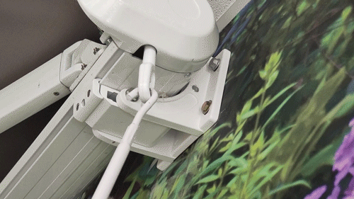 A gif showing the manual twist mechanism on the awnings which allows it to be extended retracted back into the white casette that it is attached to.