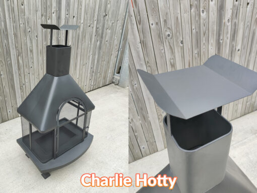 The details on the chimney of the charlie hotty fire pit. It is a flat black piece of metal, with 'winged' edges supported by two thin metal bars