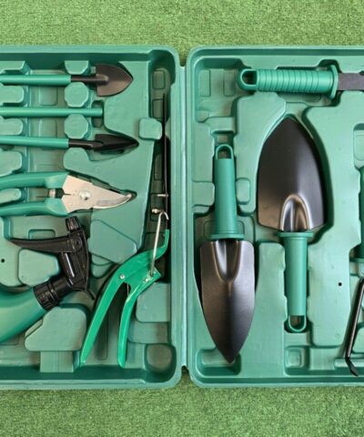 All the items of the garden tool box displayed in the box.