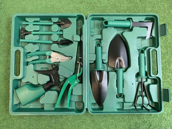 All the items of the garden tool box displayed in the box.