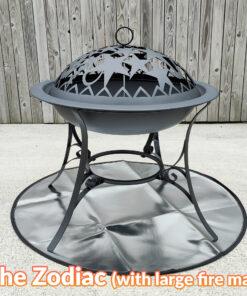 The zodiac fire pit standing on a reflective, circular fire mat. The mat is perfectly sized to suit under it.