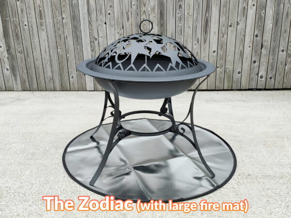 The zodiac fire pit standing on a reflective, circular fire mat. The mat is perfectly sized to suit under it.
