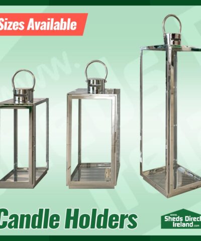 The three sizes of the lantern-style candles holders side by side on a green background. They are in order ascending in height.