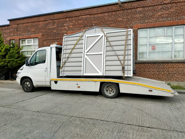 A heavy duty shed on the back of a van. It's in individual sheets and they are very tall. 