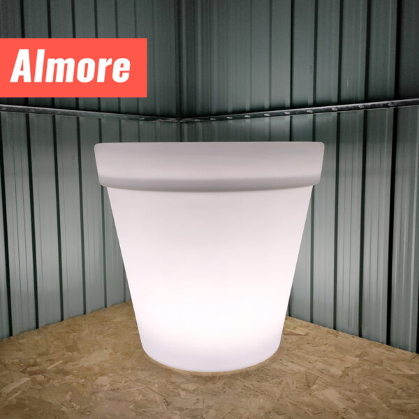 The Almore LED Plant pot glowing bright white inside a steel garden shed