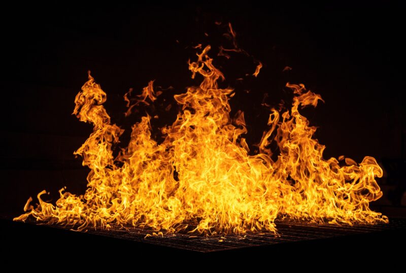 A picture of orange and dark red flames against a black backdrop. Photo by Ricardo Gomez Angel