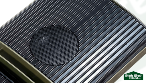 A close up look at the speaker segment of this infrared heater with speaker. It is black and circular.