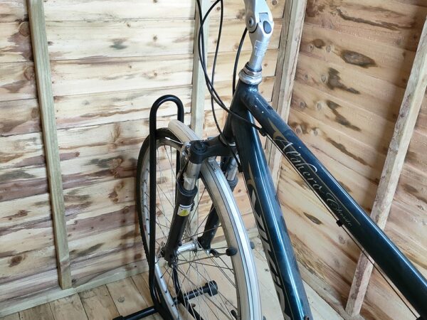 The Bike stand in use in a small, wooden shed in the Sheds Direct Ireland showroom in Finglas, Dublin