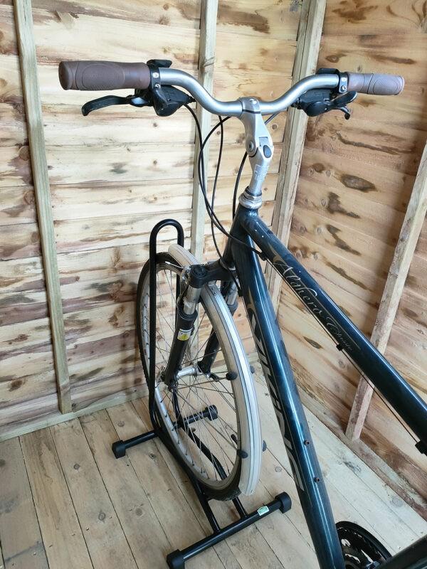 The Bike stand in use in a small, wooden shed in the Sheds Direct Ireland showroom in Finglas, Dublin