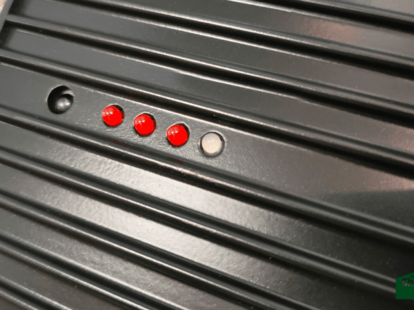 The illuminated LED Display on the Ronan Heating. There are three red bulbs and one clear / white one.