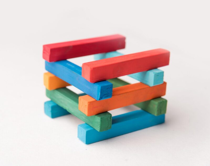 A colourful jenga stack, showing the make up of how a fire pit should look.